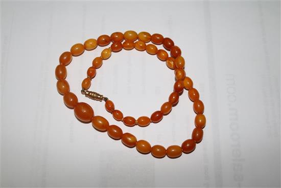 Three assorted amber necklaces, gross weight 108 grams.